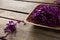 Chopped red cabbage in tray on wooden table