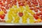 Chopped Scattered red and yellow tomatoes on a tray cooking ingredient.