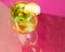 Chopped shot of rosato martini glass on pink background