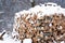 Chopped stock of firewood under snow outdoor