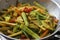 Chopped vegetables in the cooking pan while cooking for Aviyal, a popular kerala dish