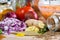 Chopped vegetables and spices on a wooden kitchen table