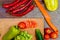 Chopped vegetables on wooden cutting board flat lay