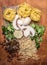 Chopped walnuts, raisins, mushrooms, herbs concept cooking a cutting board on wooden background top view