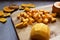Chopping butternut squash into cubes on a wooden cutting board
