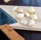 Chopping Garlic Indicates Wooden Board And Cooking