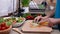 Chopping lettuce leaves for a fresh vegetable salad