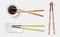 Chopsticks. Colorful wooden sushi sticks, plate with soy sauce. Asian food utensils isolated on transparent background