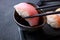 Chopsticks dipping tuna nigiri sushi into sauce