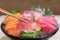 Chopsticks with Hamachi sashimi with Mixed sliced fish sashimi o