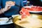 Chopsticks inserting sliced lamb into hotpot