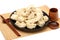 Chopsticks Pick Up Boilded Chineses Dumplings from a Plate. The Dumpling, called Jiaozi in Chinese, is a popular traditional Chine