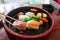 Chopsticks are pinch fresh fish sushi. Japanese food style.