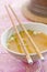 Chopsticks rest on bowl of miso