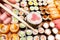 Chopsticks with tuna roll over various of sushi