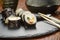 Chopsticks and tuna sushi rolls