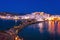 Chora of Naxos island as seen from the famous landmark the Portara with the natural stone walkway towards the village, Cyclades.