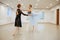 Choreographer works with young ballerina in class