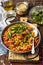 Chorizo and yellow split peas stew with padron peppers and tomatoes