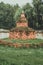 Chorten made of red colored stones in a garden in Bumthang, Bhutan