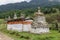 Chorten made of red and white colored stones in a garden in Bumthang, Bhutan