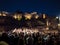 Chorus performing on the street during the art festival Noche en Blanco at night. Alcazaba arab