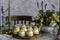 Choux Buns with Craquelin crispy cream puffs filled cream on a table decorated with spring flowers