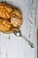 Choux pastry and spoon, on wooden background. Close Choux Cream. With a metal spoon and fork on the background