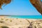 Chrisi island beach view from under big juniper tree