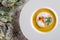 Chrismas fish soup in white plate with christmas decorations, modern gastronomy