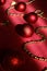 Chrisrmas tree decoration. A close up of a red and gold christmas tree decorations on red background. Christmas ball and