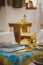 Christening in the church, golden religious utensils: bible, cross, prayer book, missal. Details in the orthodox christian church