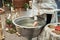 Christening in the church, priest is lighting candles at children baptismal font. Details in the orthodox christian church