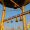 Christian bell tower with a golden cross and a golden dome in th