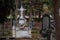 Christian cemetery. Stone tomb with crucifix.