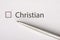 Christian - checkbox with a tick on white paper with metal pen. Checklist concept