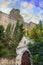 Christian church at the foot of the mountain. A small white church with golden domes. Orthodox faith.