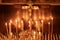 Christian church, wax candles burn before the crucifixion of Jesus Christ, faith in eternal life, prayer background, soft focus