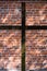 Christian Cross Against Brick Wall