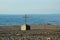 Christian cross crucifix on rocky Black Sea beach seafront Batumi Georgia