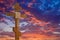 Christian cross on evening dramatic sky background