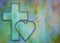 Christian cross and a heart on a vibrant background