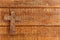 Christian cross on the wooden table. Beautiful old cross with jesus on the old wooden floor. Symbol of Faith