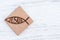 Christian fish symbol carved in wood on white vintage wooden background