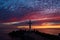 Christian Holy cross early in the morning at sunrise. The large cross stands on the edge of a breakwater on the sea