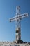 Christian metal cross placed on top of Sass Pordoi, Italian Dolomites