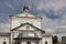 Christian orthodox white church with silver domes and gold crosses