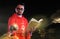 Christian pastor holding scripture with background of dark sky