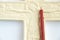 Christian plaster cross and church candle on a white background close-up, love of god