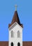 Christian white church steeple with cross